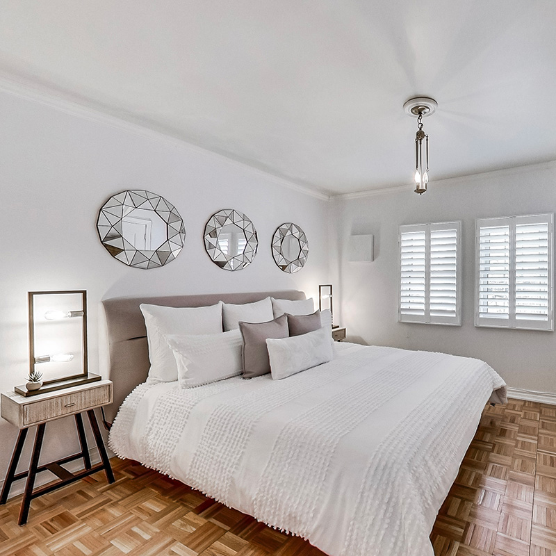 Bright bedroom with white linens.