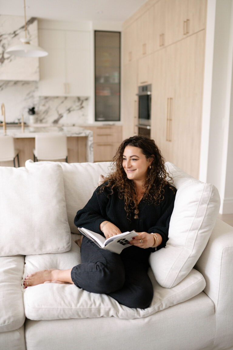 real estate agent sitting on couch